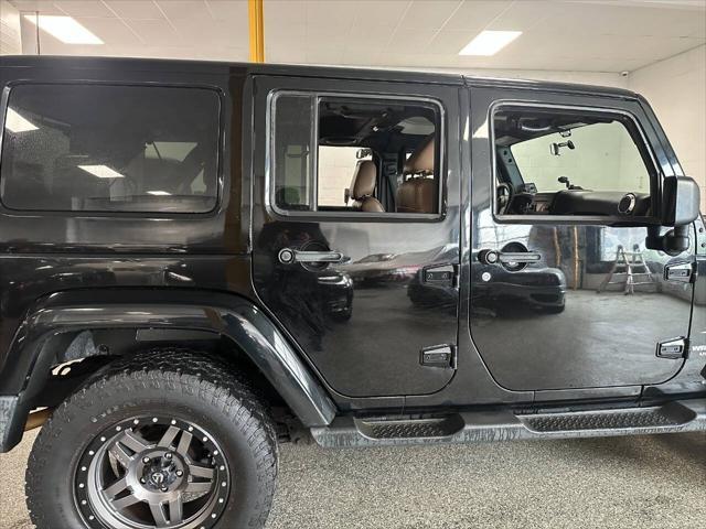 used 2011 Jeep Wrangler Unlimited car, priced at $10,450