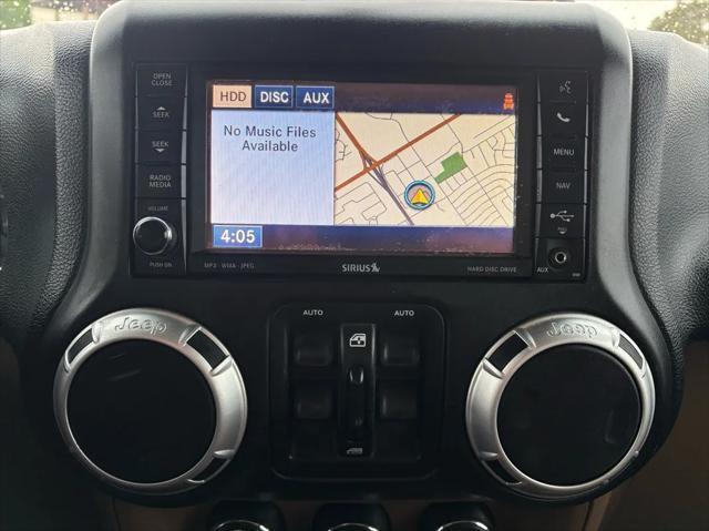 used 2012 Jeep Wrangler Unlimited car, priced at $16,992