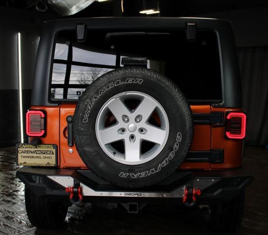 used 2011 Jeep Wrangler Unlimited car, priced at $16,499