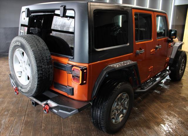 used 2011 Jeep Wrangler Unlimited car, priced at $16,499