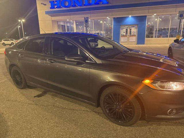 used 2016 Ford Fusion car, priced at $10,916