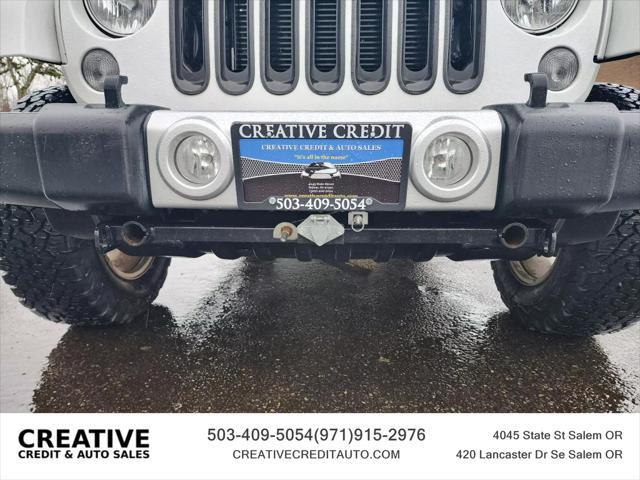 used 2014 Jeep Wrangler Unlimited car, priced at $20,990