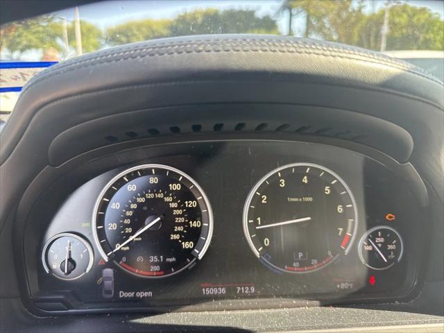 used 2013 BMW 750 car, priced at $7,999