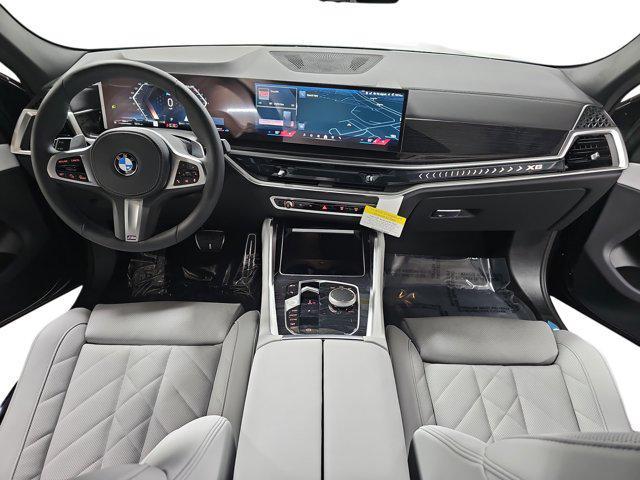 new 2025 BMW X6 car, priced at $77,875