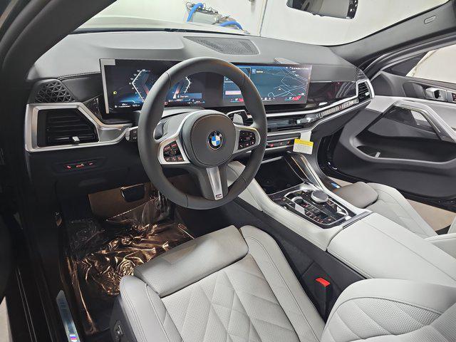 new 2025 BMW X6 car, priced at $77,875