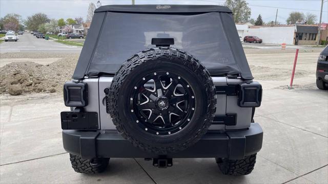 used 2014 Jeep Wrangler Unlimited car, priced at $16,495