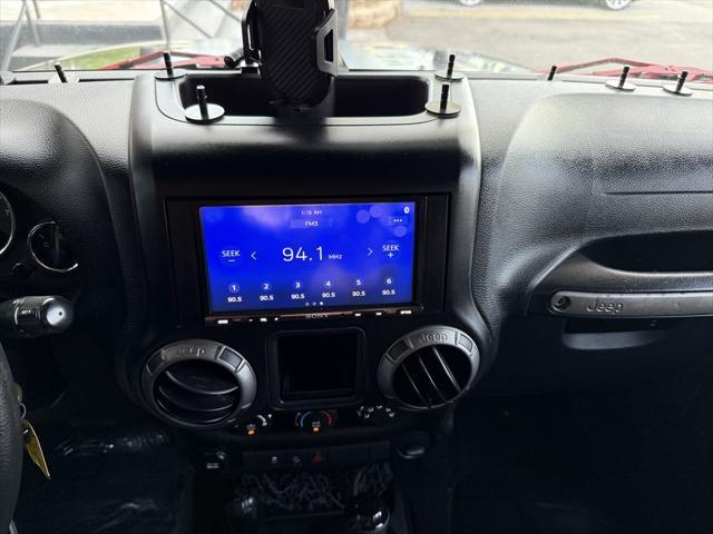 used 2015 Jeep Wrangler Unlimited car, priced at $16,995