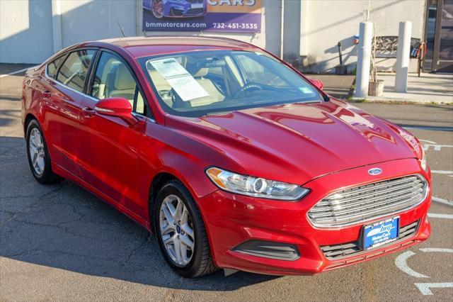 used 2016 Ford Fusion car, priced at $10,900