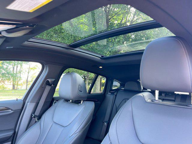 used 2024 BMW X4 car, priced at $42,500