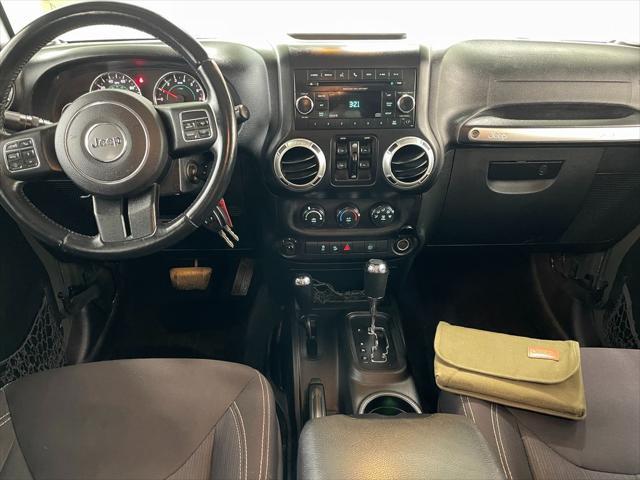 used 2015 Jeep Wrangler Unlimited car, priced at $16,495