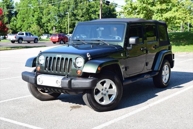 used 2011 Jeep Wrangler Unlimited car, priced at $15,490