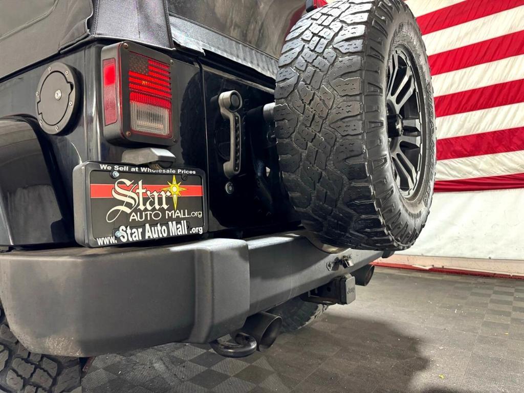 used 2014 Jeep Wrangler Unlimited car, priced at $18,411
