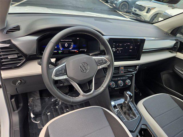 used 2025 Volkswagen Taos car, priced at $23,617