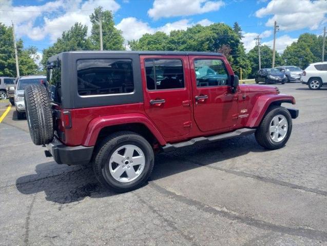 used 2012 Jeep Wrangler Unlimited car, priced at $16,395