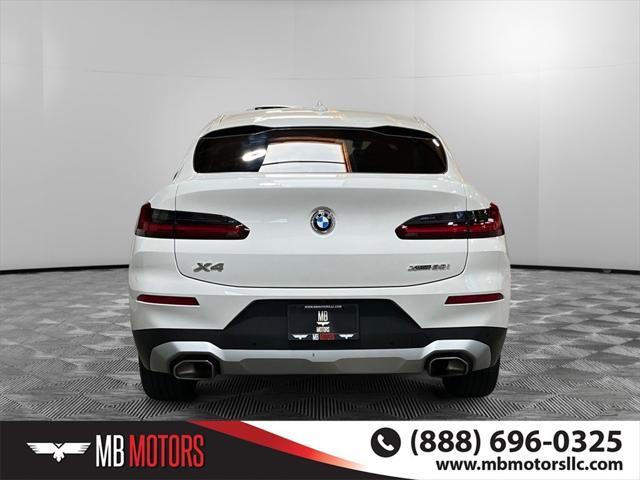 used 2022 BMW X4 car, priced at $38,995