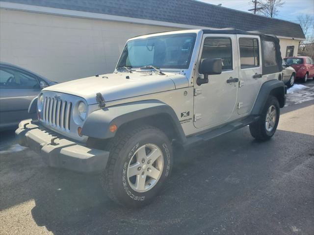 used 2009 Jeep Wrangler Unlimited car, priced at $10,900