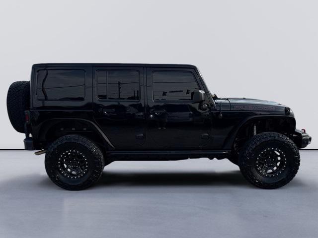 used 2015 Jeep Wrangler Unlimited car, priced at $21,621