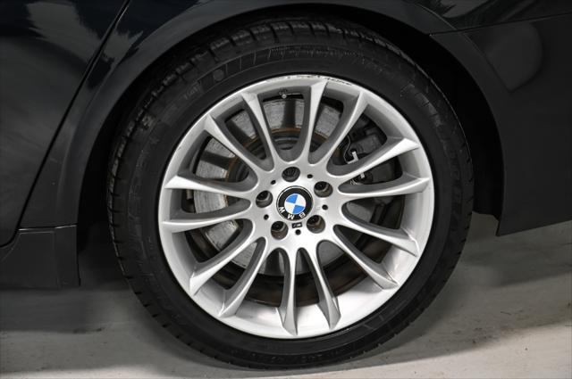 used 2015 BMW 750 car, priced at $17,495