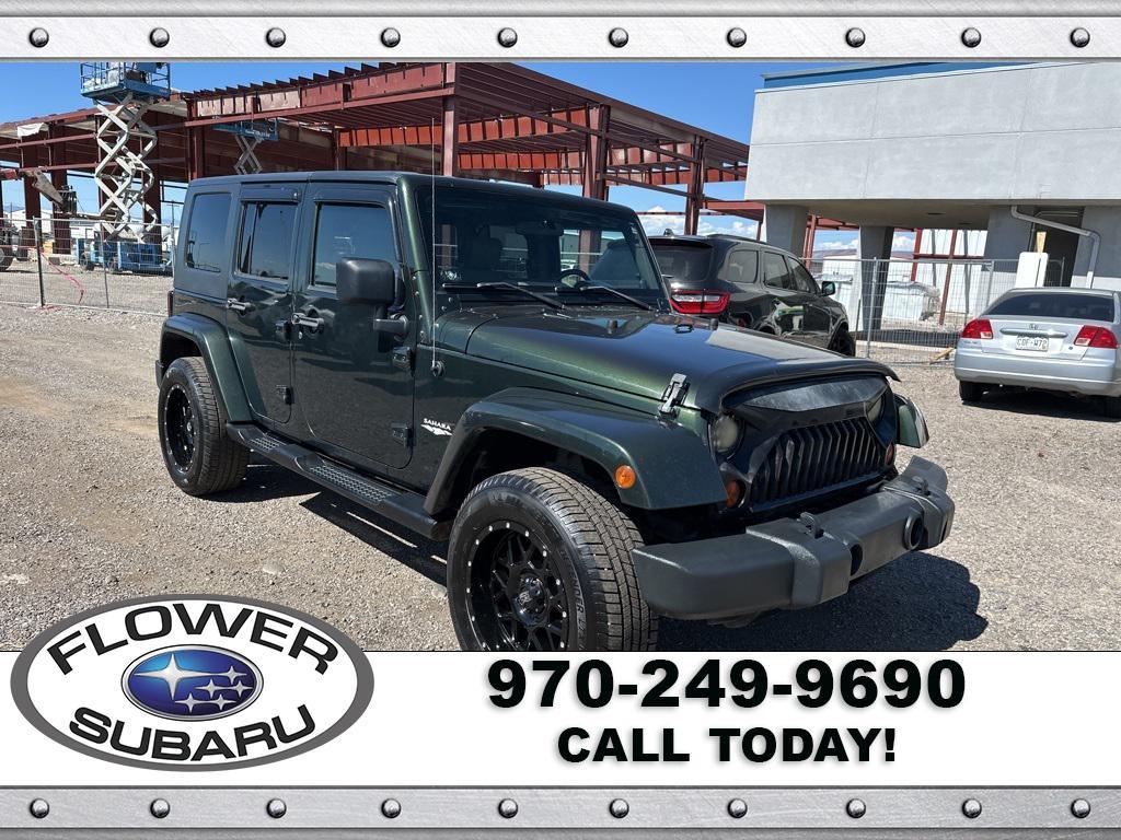 used 2010 Jeep Wrangler Unlimited car, priced at $13,596