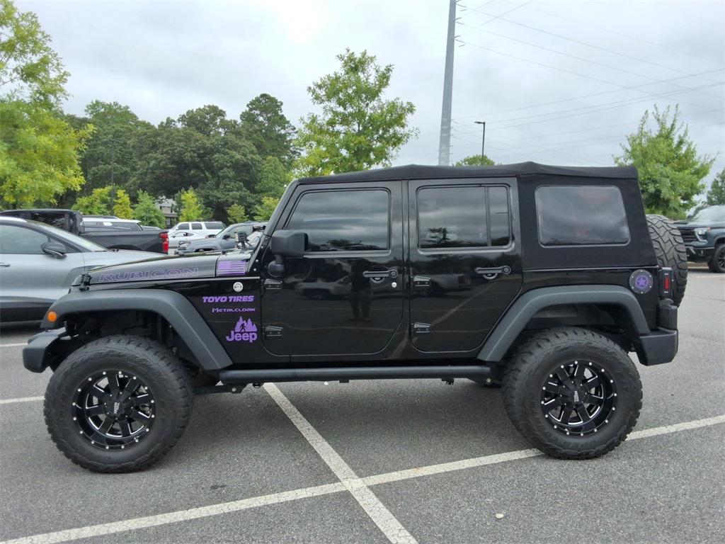 used 2014 Jeep Wrangler Unlimited car, priced at $27,344