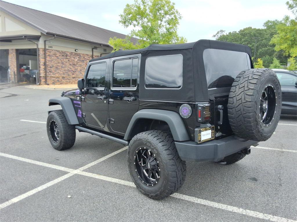 used 2014 Jeep Wrangler Unlimited car, priced at $27,344