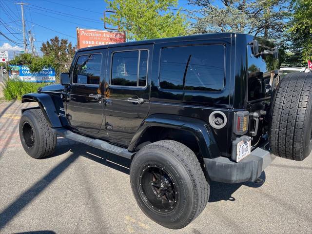 used 2014 Jeep Wrangler Unlimited car, priced at $22,875