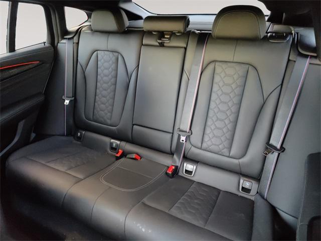 used 2023 BMW X4 M car, priced at $63,192