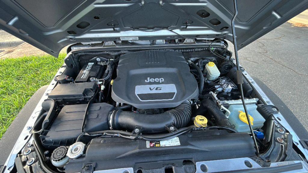 used 2014 Jeep Wrangler Unlimited car, priced at $16,475