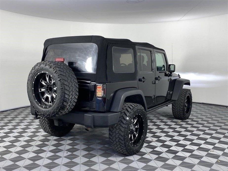 used 2013 Jeep Wrangler Unlimited car, priced at $23,891