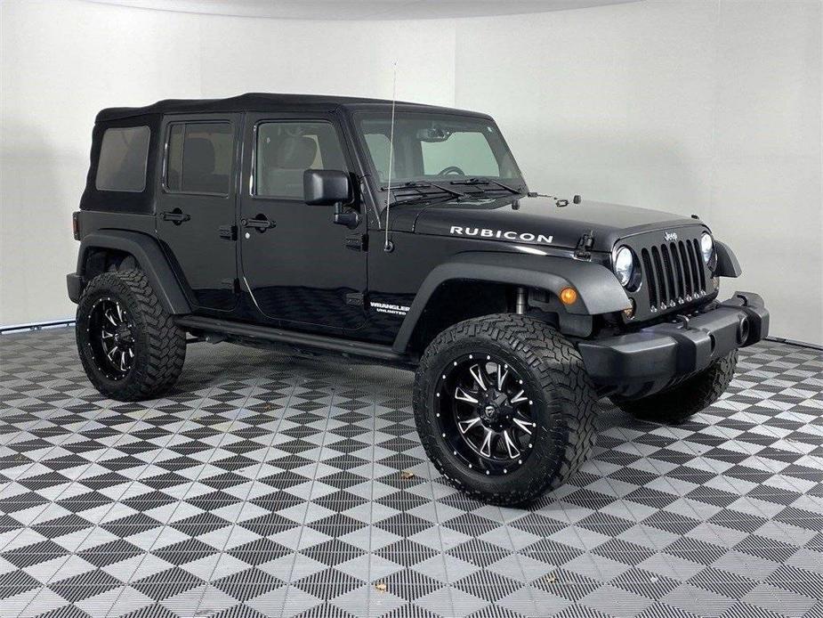 used 2013 Jeep Wrangler Unlimited car, priced at $23,891