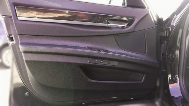 used 2015 BMW 750 car, priced at $14,499