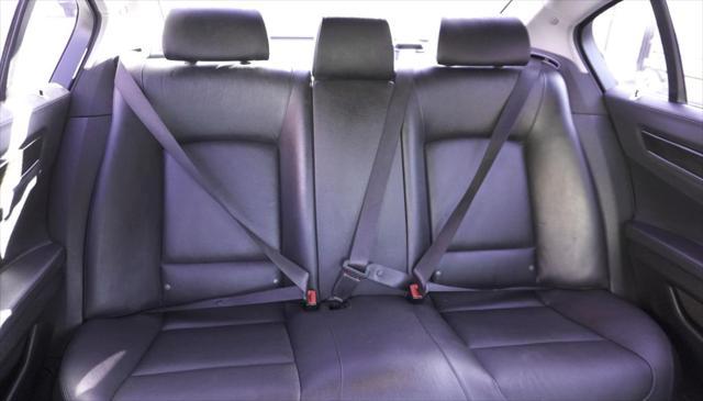 used 2015 BMW 750 car, priced at $14,499