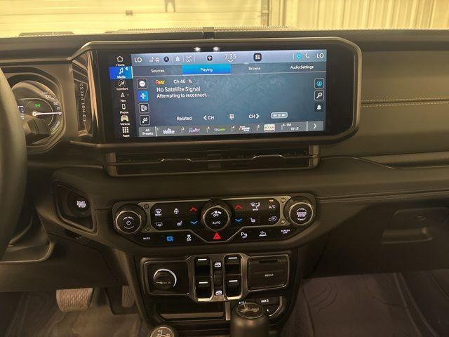 used 2024 Jeep Wrangler 4xe car, priced at $43,339