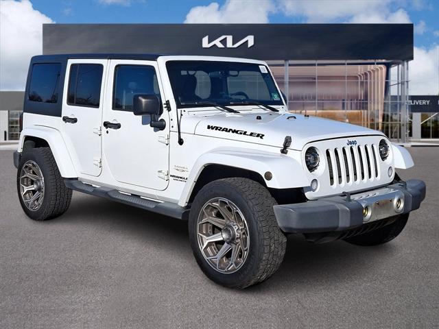 used 2012 Jeep Wrangler Unlimited car, priced at $13,499