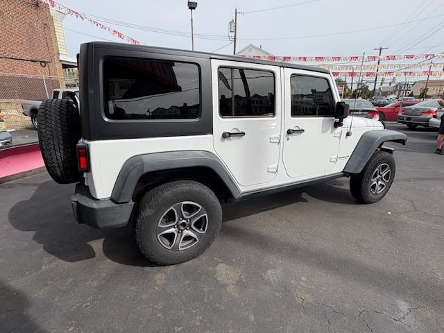 used 2013 Jeep Wrangler Unlimited car, priced at $9,990