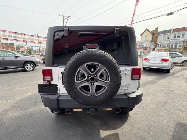 used 2013 Jeep Wrangler Unlimited car, priced at $9,990