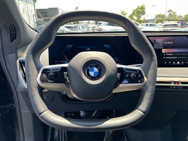 new 2026 BMW iX car, priced at $83,495