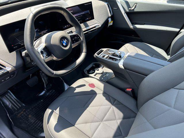 new 2026 BMW iX car, priced at $83,495