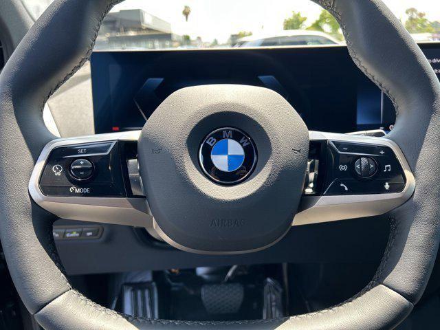 new 2026 BMW iX car, priced at $83,495