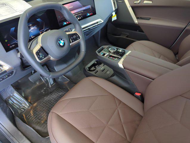 new 2026 BMW iX car, priced at $96,695