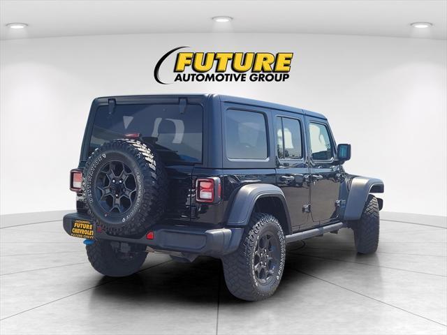 used 2023 Jeep Wrangler 4xe car, priced at $29,574
