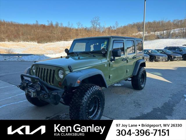 used 2013 Jeep Wrangler Unlimited car, priced at $15,902