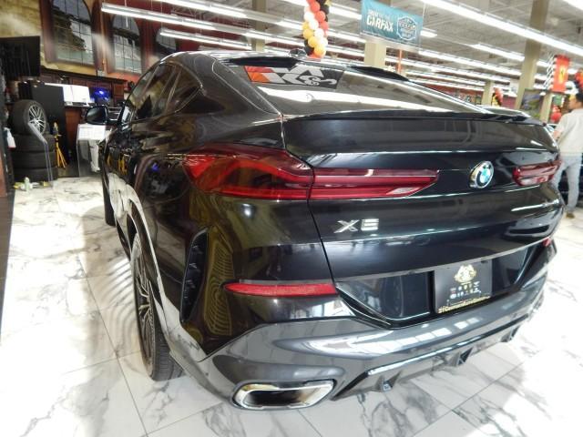 used 2024 BMW X6 car, priced at $56,821