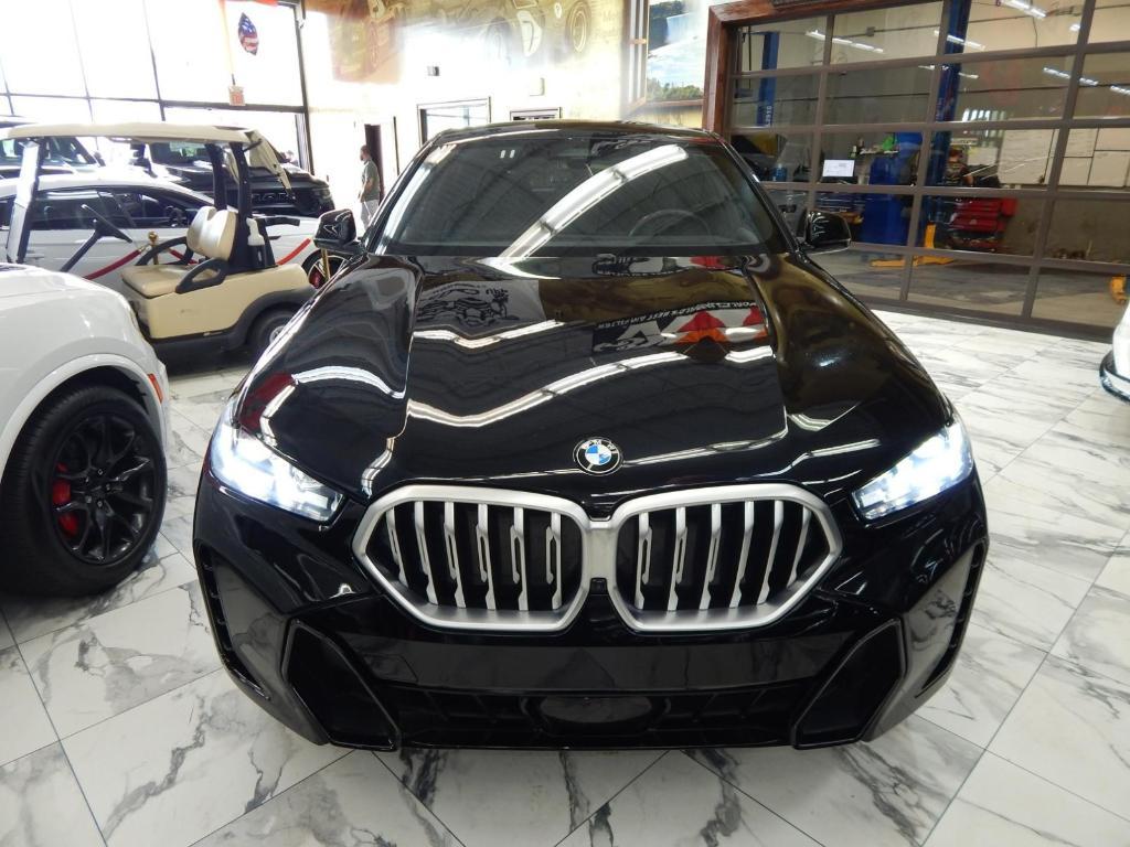 used 2025 BMW X6 car, priced at $58,995