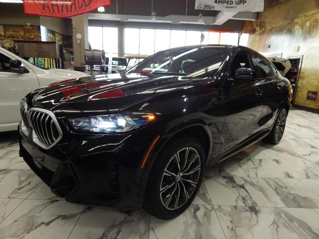 used 2025 BMW X6 car, priced at $58,995