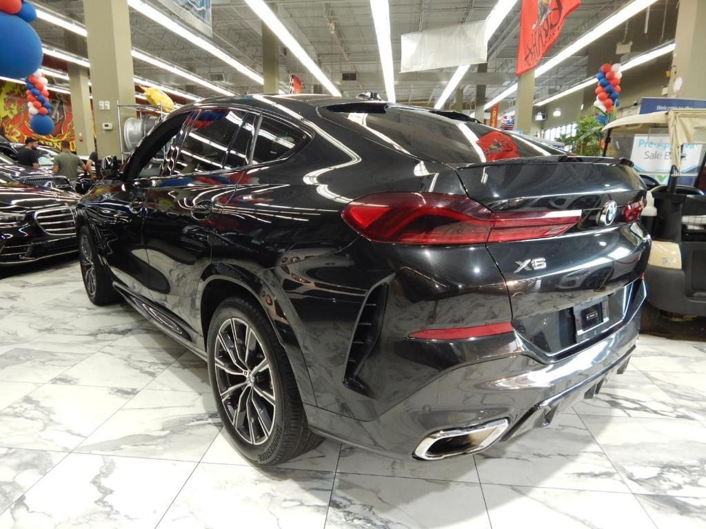 used 2025 BMW X6 car, priced at $58,995
