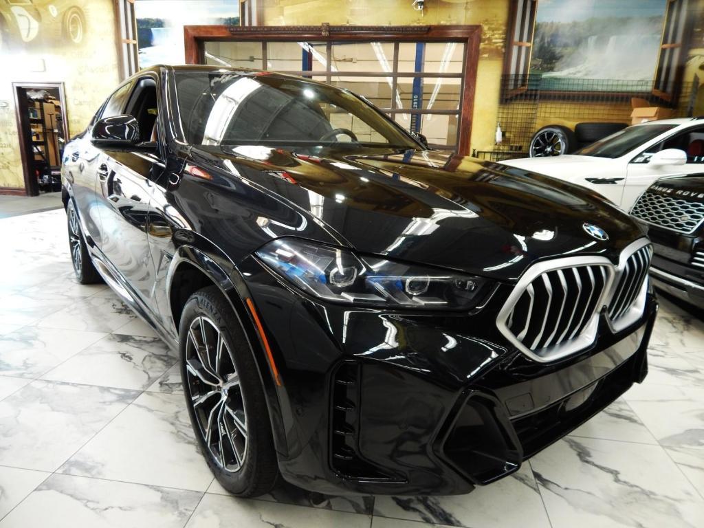used 2025 BMW X6 car, priced at $58,995