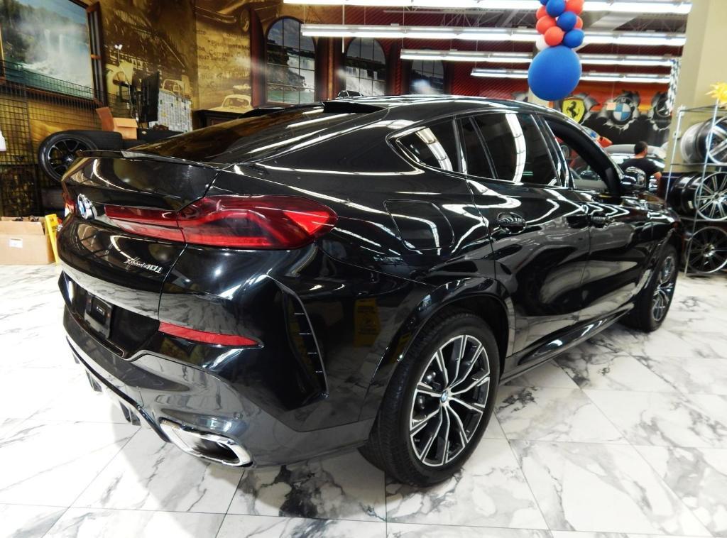 used 2025 BMW X6 car, priced at $58,995