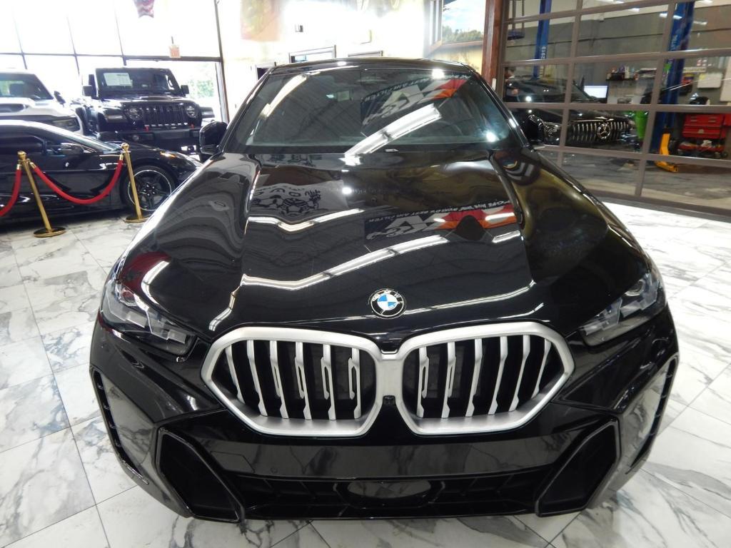 used 2025 BMW X6 car, priced at $55,995