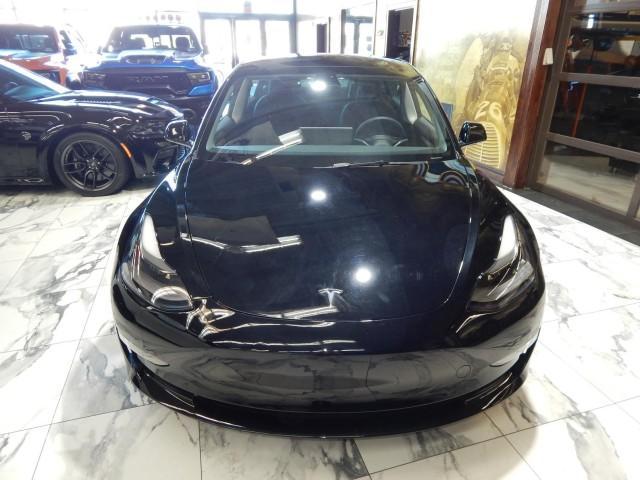 used 2023 Tesla Model 3 car, priced at $30,000